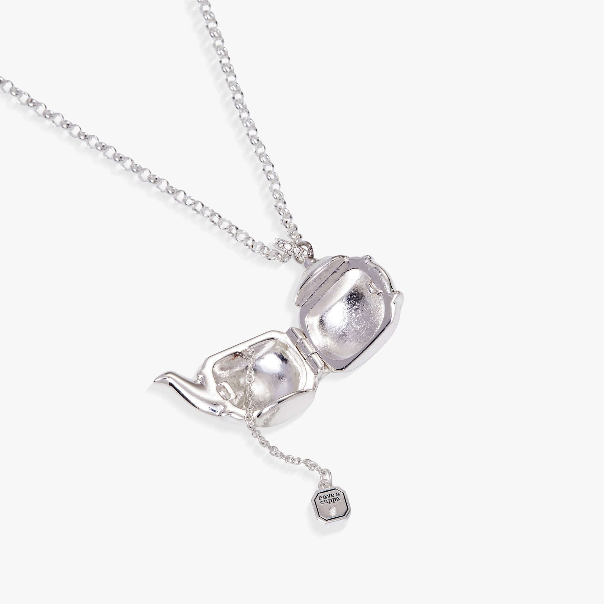 Open teapot locket revealing tea bag charm