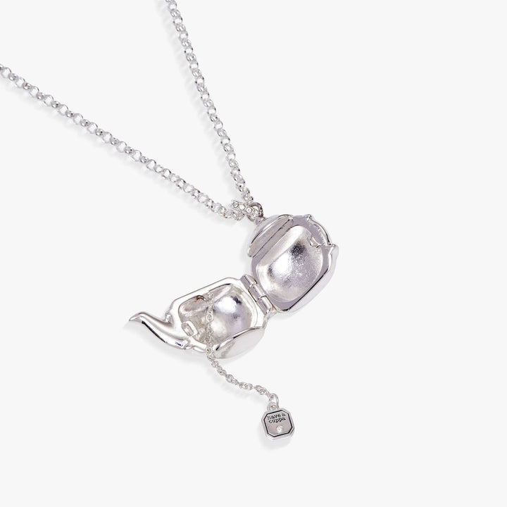 Open teapot locket revealing tea bag charm