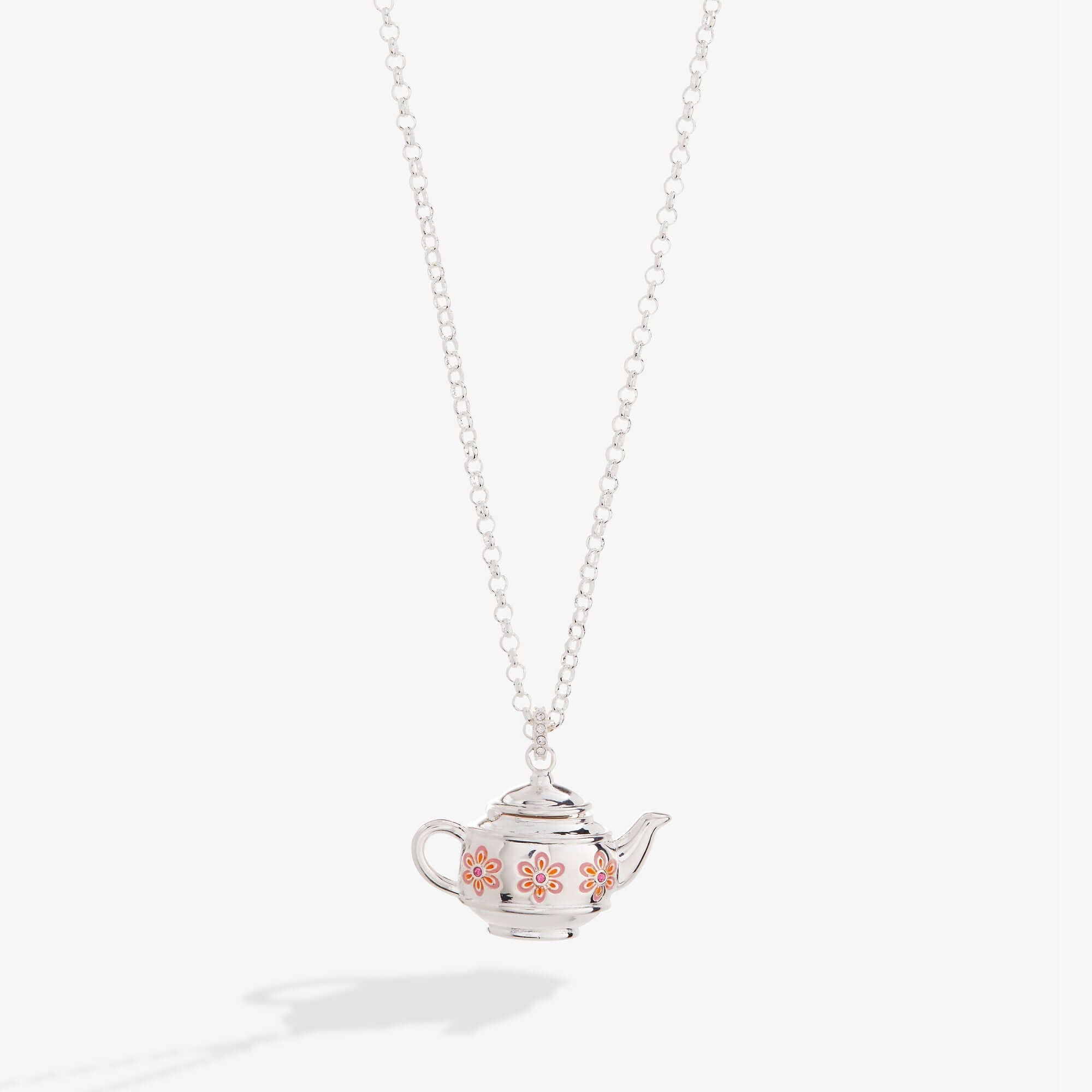 Silver teapot-shaped pendant on a chain against a white background